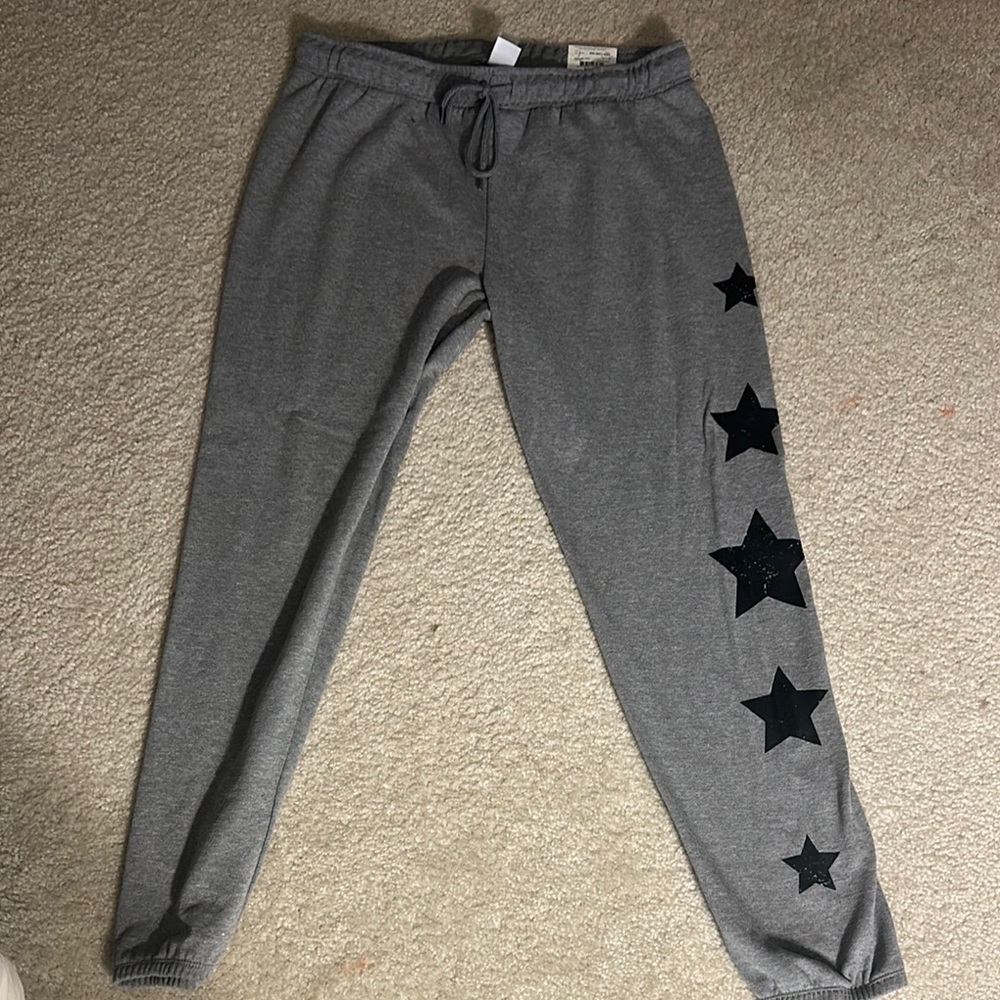 New with tags. Gray Star-Patterned women's  Joggers. Size m